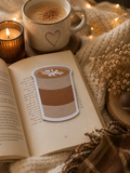 Post-it en forme de café latte sur un livre ouvert