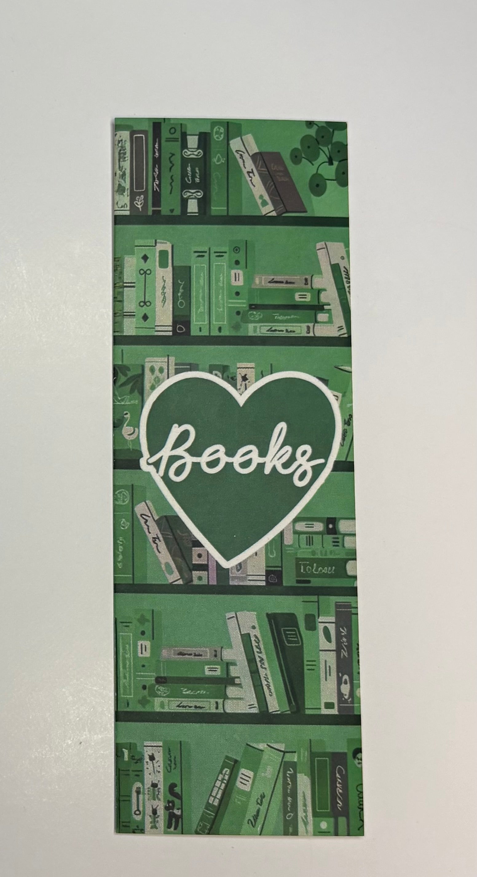 Signet empilage de livres vert avec coeur Books